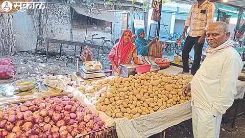 Mirabai Patil selling potatoes at the Mahatma Phule vegetable market here.