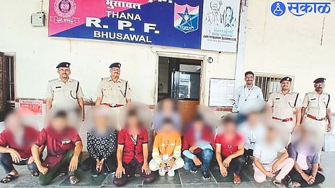 Railway police with suspected black marketers of tickets.