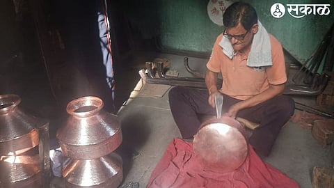 Artisan making pottery.