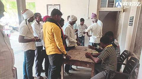 Nandgaon Farmers taking payment in cash in the market committee here.