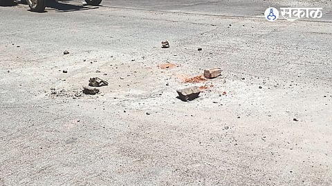 Bujvili pothole on the road in front of the market committee entrance.