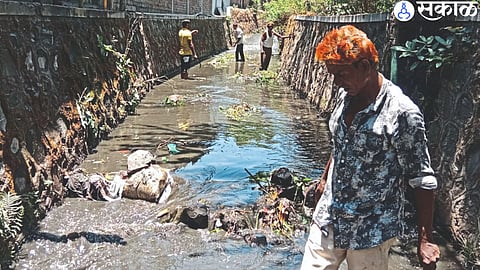 Employees during drain cleaning.