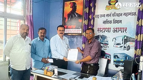 Manager Rajendra Ahire while giving direct pass to students from Satana Agara to the college to Vijay Medhane, principal of the college in Satana.