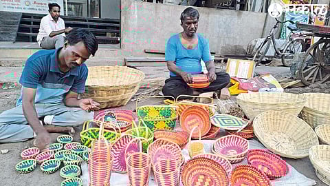 Artisans engaged in making baskets in a bamboo alley in Khola Gali