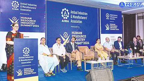 Katharina Kolking while guiding the Human Resource Summit organized by AIMA. Other dignitaries on the platform next to it.