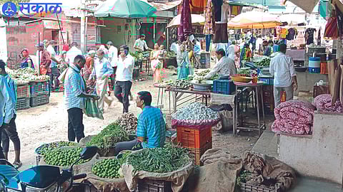 Consumers while buying vegetables in the main market.