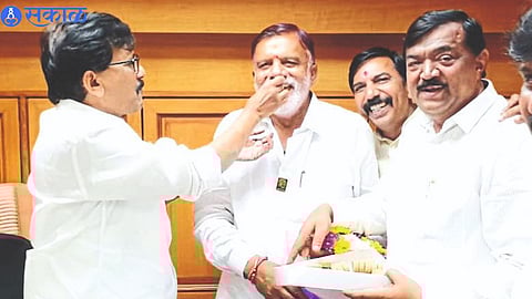 Shiv Sena leader Sanjay Raut while congratulating Shiv Sena Uddhav Balasaheb Thackeray MP Rajabhau Waje who was elected from Nashik.