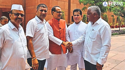 Congress District President Shirish Kotwal during a discussion with Union Agriculture Minister Shivraj Singh Chouhan in the Parliament premises on Tuesday