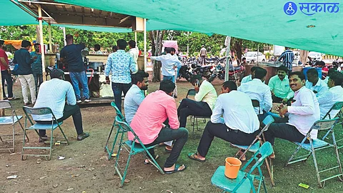 Customers chatting at a tea shop in Malegaon