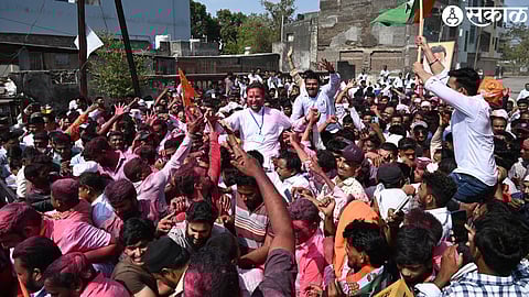Adv. Gowal Padavi was picked up by the workers and cheered.