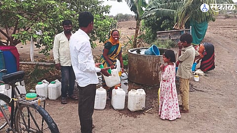 Tribal brothers came to fill water at Sunny Thorat's water table.