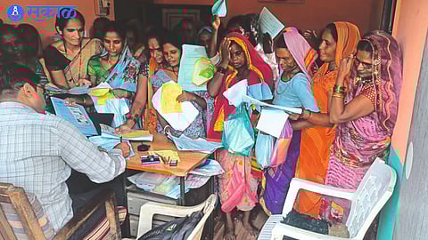 Crowd of women in Talathi office.