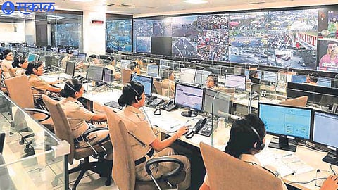 A lady police officer taking a call on Dial 112.