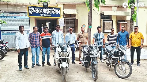 Police inspector Dheeraj Mahajan and team with two-wheeler seized from the thief.