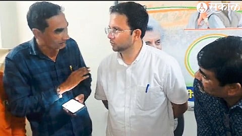 Amol Patil, Deputy Sarpanch representative of Pingane talking to MP Gowal Padvi regarding the electricity problem of the village.