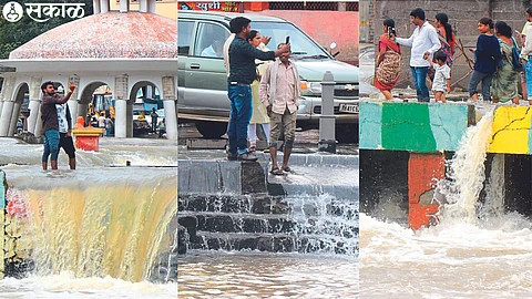 Tourists taking selfies on the banks of the Godavari river even when the water is flowing.
