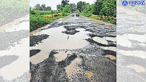 Potholes and standing water on the bridge near the Hanuman temple on the highway leading from here to Chopra.