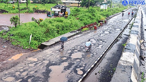 Flyover work is underway at Asangaon on the Mumbai-Nashik highway. Due to this, the traffic is diverted through the service road. There are big potholes on this service road.