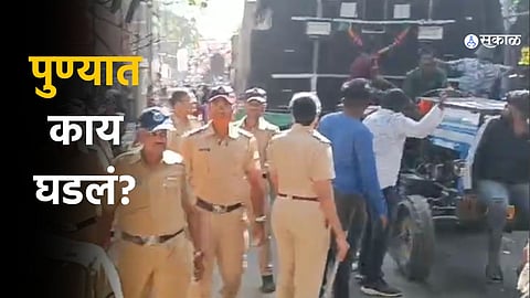 Ganesh mandal workers protesting on Tilak Road over the speaker ban before police intervention eased the tension.