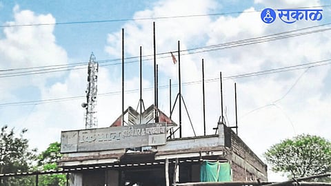 Employees removing unauthorized hoardings in the city