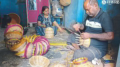 Artisans engaged in the work of making baskets for Ghatstalling.