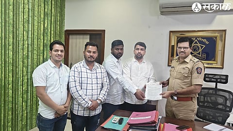 Nationalist Student Congress Sharad Chandra Pawar party office bearer while giving a statement to Crime Branch Deputy Commissioner of Police Prashant Bachhao.