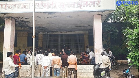 Employees and citizens gathered outside the Panchayat Samiti office.
