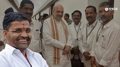 Nilesh Lanke and Amit Shah smiling together in Parliament