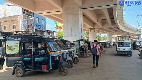 Private vehicles parked under the flyover here