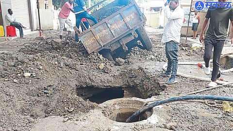 Pits dug by contractor for sewerage works.