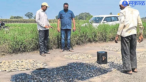 Workers digging potholes in Achole Nala area.