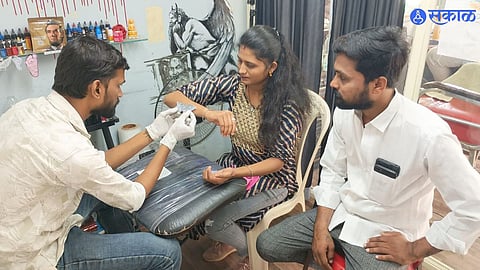 Young woman removing tattoo in Malegaon