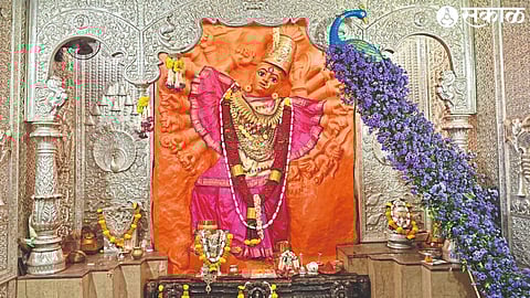 Adimaya's resplendent and reassuring idol and attractive peacock made of flowers.