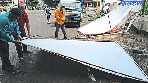 employees removing billboards