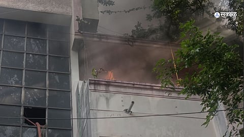 Firefighters working to control the fire at a library in Navi Peth, Pune.