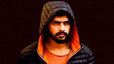 Luxury items and cash associated with gangster Lawrence Bishnoi, highlighting annual family expenditures.