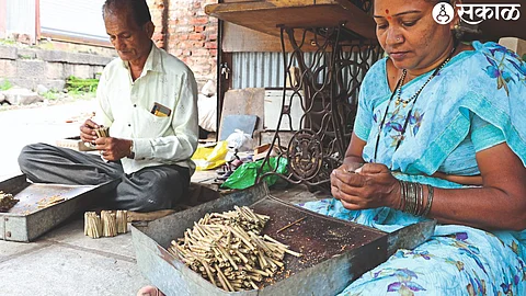 A couple preparing vidi after receiving raw material in Dubere village of Sinnar taluka