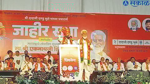 Chief Minister Eknath Shinde speaking at a public meeting. Dada Bhuse, the candidate of Mahayuti from neighboring Malegaon district.