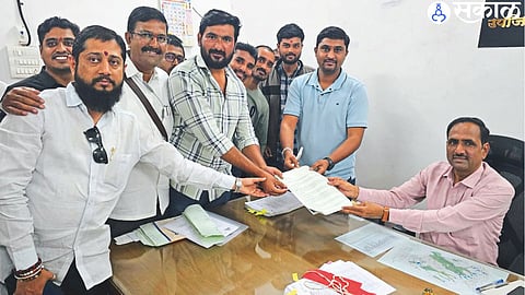 Aadhaar Central Director giving a statement to Deputy Collector Tukaram Hulawale on Thursday.