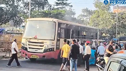 Smoke coming from the bus, passengers struggling to get out.