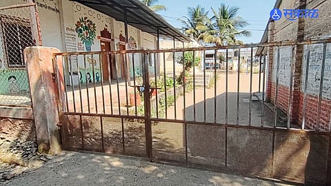 Villagers protesting outside Bhirdachiwadi School over teacher misconduct and demanding a transfer.