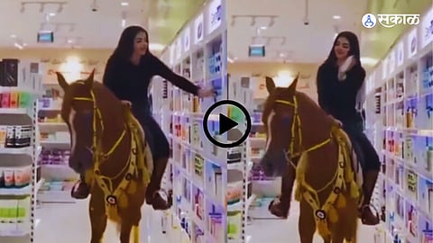 Girl Riding Horse In Mall