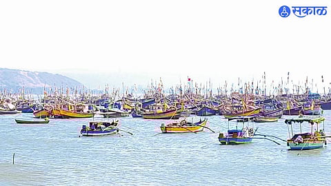 Fishing boats docked as northern winds force a temporary halt to operations, leading to billions in trade losses."