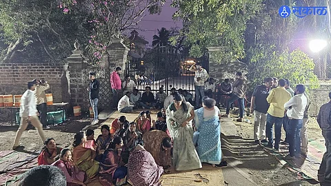 Supporters gather outside the Nibalkars' homes in Phaltan and Pune while tight security is enforced during their ongoing 36-hour inquiry.