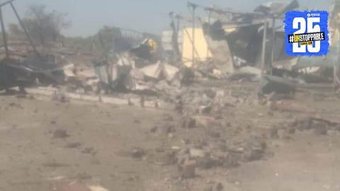 Smoke and debris seen at the explosion site of an explosive manufacturing factory in Nagpur