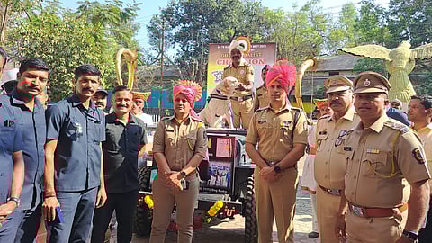 Surya proudly holds his gold medal for explosive detection at the All India Police Meet, demonstrating excellence in law enforcement skills.