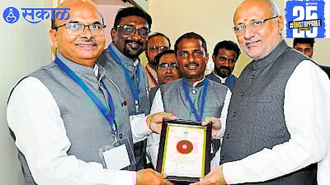 "Governor C.P. Radhakrishnan receives the first pearl harvested from the university’s new pearl cultivation project."