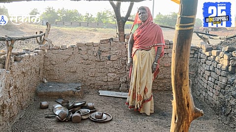 The aftermath of the fire, where cooking in burnt pots has become the only option as victims await help to rebuild their destroyed hut.
