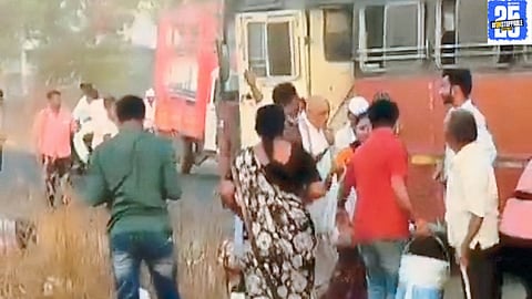 Passengers flee through windows as smoke pours out of the Barshi-Dharashiv bus, with locals providing swift assistance."