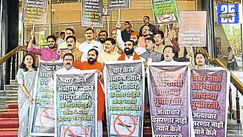 "Ruling and opposition party members protest on the steps of Maharashtra Legislative Assembly, escalating political tensions in the state."